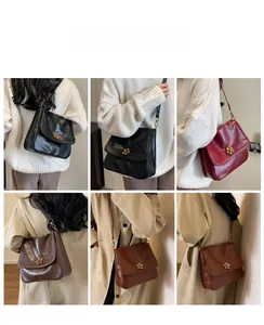 Retro shoulder bag with floral metal buckle shown in black, burgundy, and brown colors