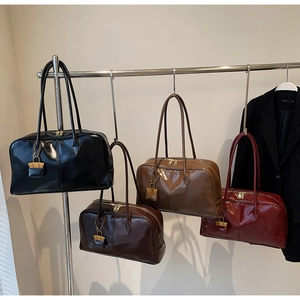 Detailed display of four PU leather Boston handbags in black, coffee, brown and wine red
