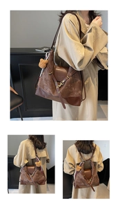 Detail of dark brown matte tote bag with teddy charm, showing dual strap options