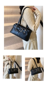 Detailed close-up of a vintage black leather underarm bag with silver buckles and straps
