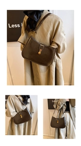 Detail of vintage dark brown glossy leather shoulder bag with golden metallic buckle