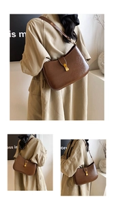 Detail view of brown vintage leather crossbody bag with elegant gold metal clasp