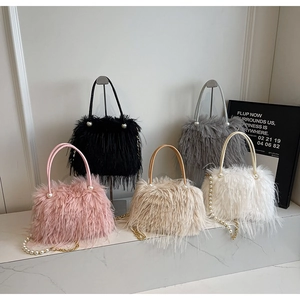 Faux fur bucket bags in five colors with pearl handles and gold chain straps