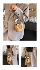 Detail of mini plush bucket bag with khaki faux fur and vintage metal buckle strap