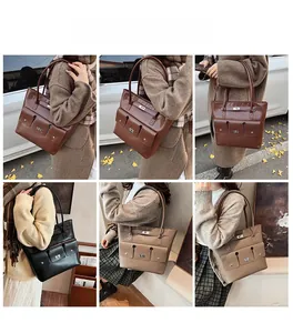 Détail du grand sac cabas avec trois poches avant et boucle métallique en plusieurs tons