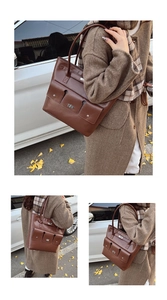 Détail du sac cabas en cuir marron avec poches frontales et fermoirs rotatifs argentés