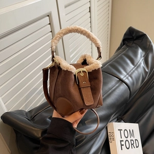 Maillard style brown suede and plush shearling bucket bag with gold hardware