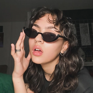 Fashionable black cat-eye semi-rimless sunglasses for women with a trendy street style