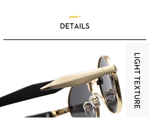 Detail of golden metal hinges and black temples on vintage oval sunglasses