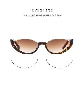 Detail of cat-eye sunglasses featuring tortoise frames and gradient brown lenses