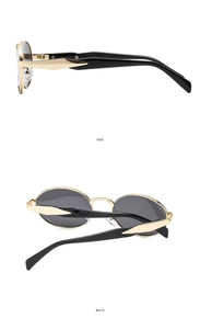 Detail view showing the sleek black side temples and back hinge of oval sunglasses