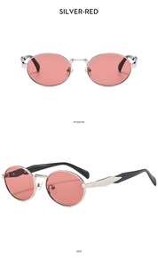 Detail view of oval silver metal sunglasses with red lenses and bicolor temples