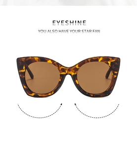 Classic cat-eye sunglasses with tortoiseshell frames and brown gradient lenses