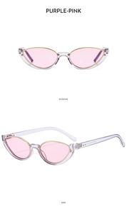 Detail view of purple-pink cat eye half-frame sunglasses with gold metal wire trim