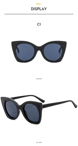 Detail view showing front and 45-degree angle of retro cat-eye sunglasses in black and gray