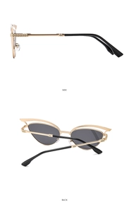 Detailansicht der goldenen Cat-Eye-Sonnenbrille mit hohlen Flügeln und Scharnieren
