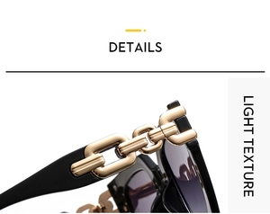 Close-up of square sunglasses featuring golden metal chain detail on black temples