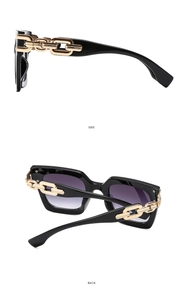 Side and back view of square black sunglasses with purple gradient lenses and gold chain arms