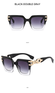 Detail view of square gradient oversized sunglasses with bold gold metal chain temples