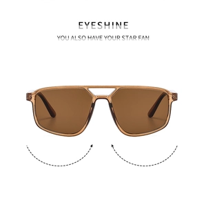 Detail of amber pilot sunglasses with double-bridge frame and brown lenses