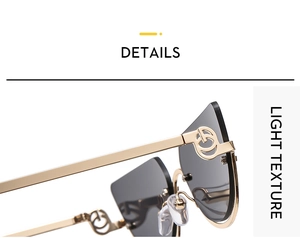 Detail of gold metal cat-eye sunglasses featuring unique G-shaped镂空 hinge design