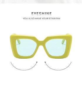 Detailed view of square lime green frame sunglasses with translucent light blue lenses