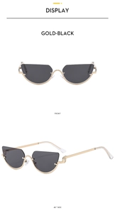 Detail view of Gold-Black half-frame cat eye sunglasses with metal hollow-out temple design
