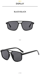 Front and 45-degree side views of black double-bridge aviator sunglasses with black lenses