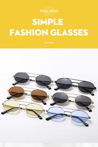 Detail view of retro oval sunglasses with double bridge metal frames in multiple lens colors