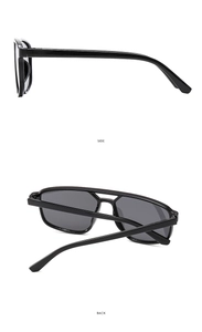 Detail view of black double-bridge aviator sunglasses showing side and back profiles