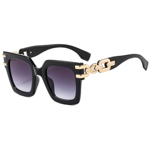 Fashionable square oversized sunglasses with purple gradient lenses and gold chain temples