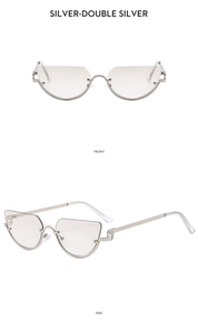 Detail of silver half-frame cat-eye sunglasses with gradient lenses and镂空 temple rings