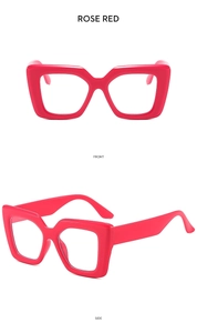 Detail view of stylish rose red oversized square sunglasses showing front and side angles