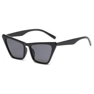Classic black cat-eye sunglasses with thick plastic frames and dark grey UV lenses