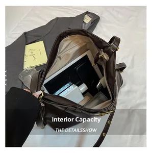 Top view showing large capacity interior of dark brown tote bag with daily essentials