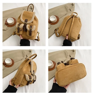 Detail view of khaki suede backpack with faux shearling trim and metal buckle accents