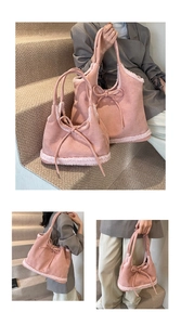 Close-up of pink suede tote bag with cream faux fur trim and cute bow drawstring detail