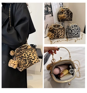 Detail view of leopard print shell bags with gold chain straps and plush pompom charms