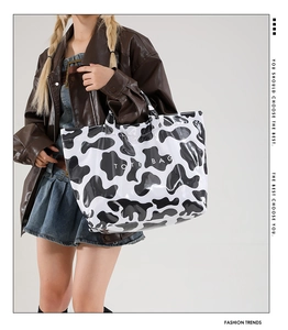 Chic cow print large tote bag shown on a model for a modern street style fashion look
