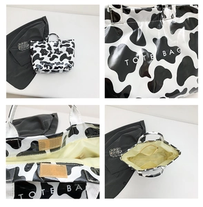 Detail view of cow print PVC tote bag showing internal pockets and velcro closure