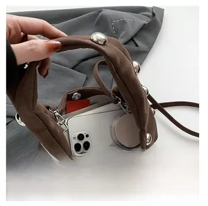 Interior view showing the large capacity of the brown suede bag with silver studs