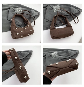 Detail view of brown fabric crescent bag with silver metallic studs from multiple angles