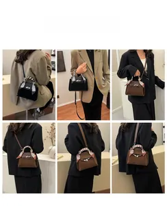 Detailed views of vintage matte suede Kelly bag showing handheld and crossbody styling options