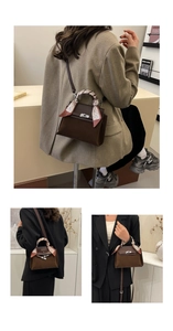 Detail of a brown suede Kelly bag featuring a silk scarf wrap and gold metal hardware
