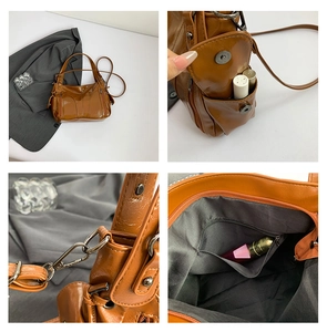 Macro details of brown PU leather tote bag with metallic hardware and zip compartments