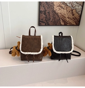 Mini retro backpack detail with white faux fur trim and cute bear plush charm
