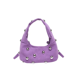 Purple suede crescent shoulder bag with silver ball rivets in a trendy Y2K punk style