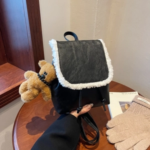 Mini black backpack with white faux fur trim and cute brown plush bear charm