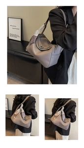 Detail of taupe pebbled leather handbag with geometric scarf wrapped handle and silver lock