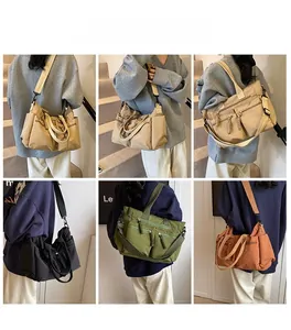 Detailed view of the multi-pocket canvas tote bag showing the various storage compartments